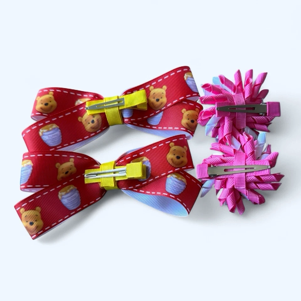 Lote de 2 pares de clips de cocodrilo con moño para niños pequeños de Winnie The Poo - Foto 2 de 4