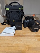 Cannon EOS R plus 24-240 lens, carry case, instruction book, charger, and cable