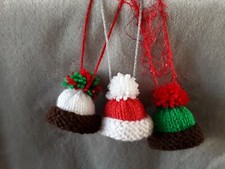  HAND KNITTED CHRISTMAS DECORATIONS WITH SPARKLY STRINGS.   SMALL HATS.