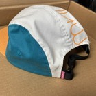 White and teal 5-panel hat with orange accents, black strap, and “MNWKA” text in white on the side.