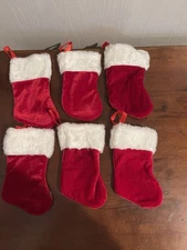 Six mini red velvet Christmas stockings
