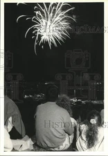 Press Photo Fireworks explode over Crowd gathered for Event - sya66384
