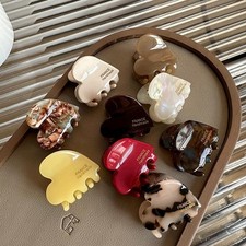 Colorful 3.5cm heart-shaped mini hair claw clips made from acetate.