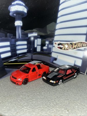 Hotwheels bundle of two, wheel swap 99Ford F-150SVT Lightning,92 Mustang 