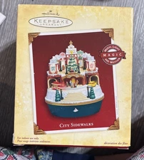 Hallmark Keepsake Ornament “ City Sidewalks” Music Light and Motion Magic NEW