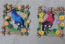 Country style blue bird and red bird  each in the frame with roses
