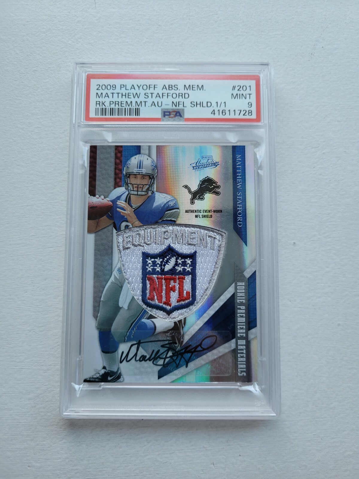 Matthew Stafford Playoff Absolute Memorabilia #201 Rookie Premiere Materials Autograph-NFL Shield 1/1
