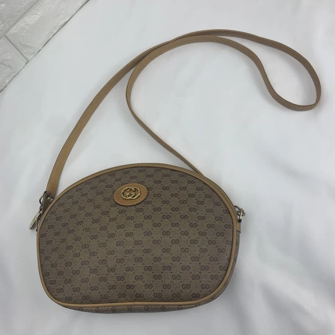 Gucci sac bandoulière ovale vintage entrelacé logo Gg bandoulière cuir marron