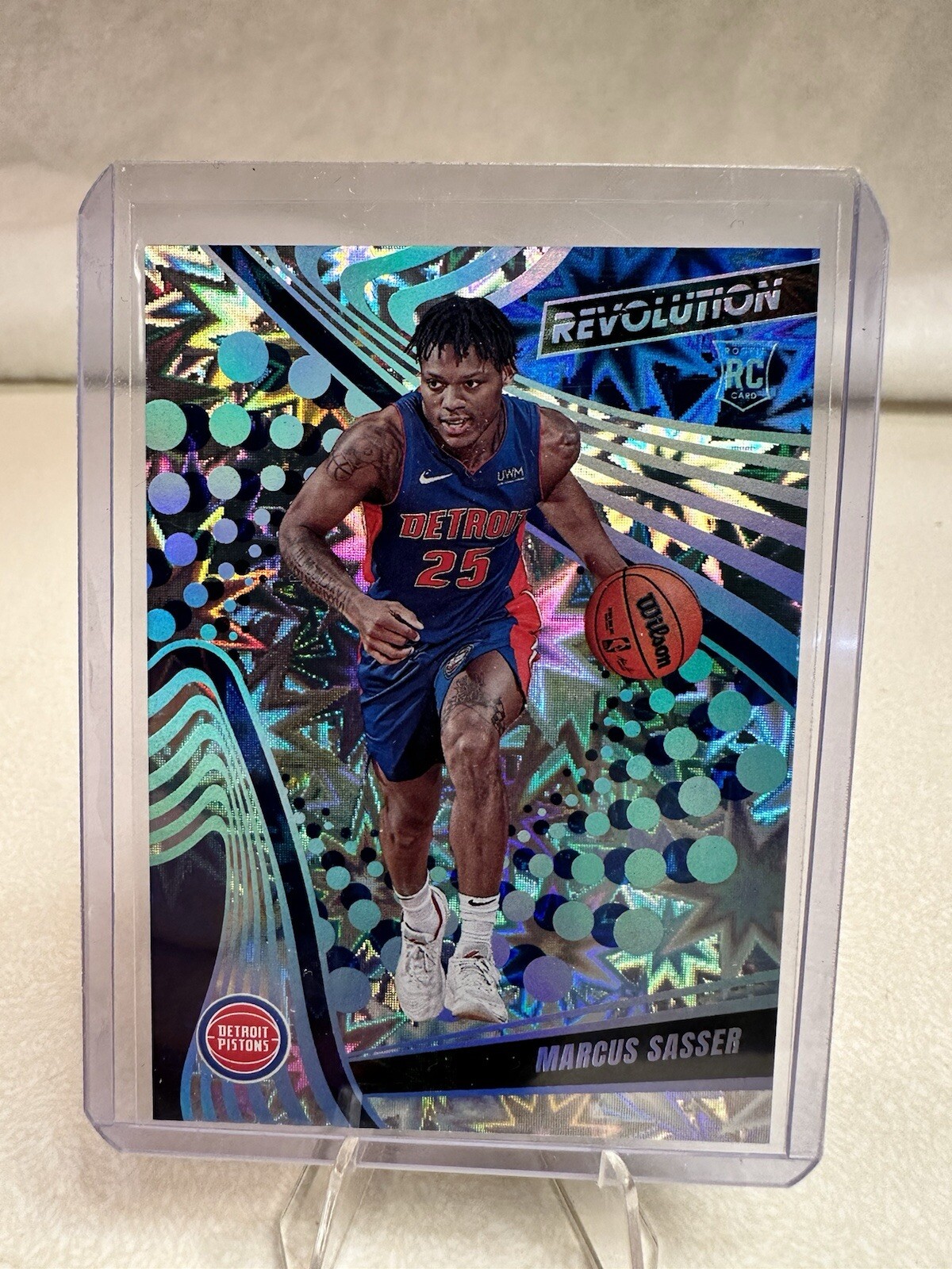 2023 Panini Revolution Impact Marcus Sasser 55/149 RC #126 Rookie Partial Jersey