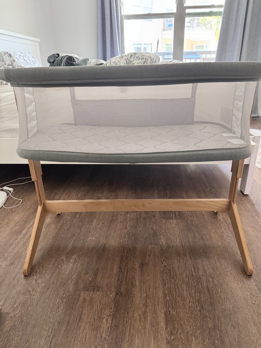 Newton Baby Bassinet Bedside Sleeper with Mattress Sheet Solid