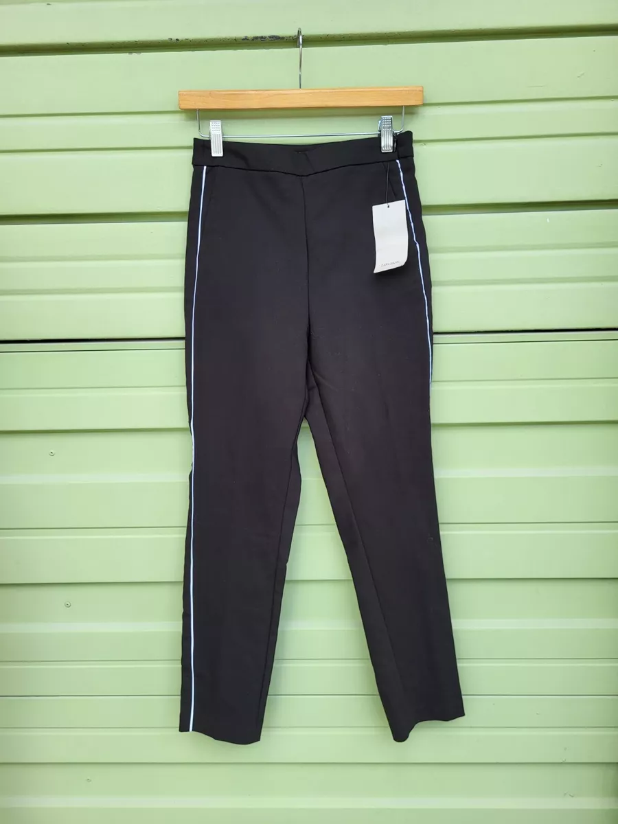 White trousers with shop black side stripe