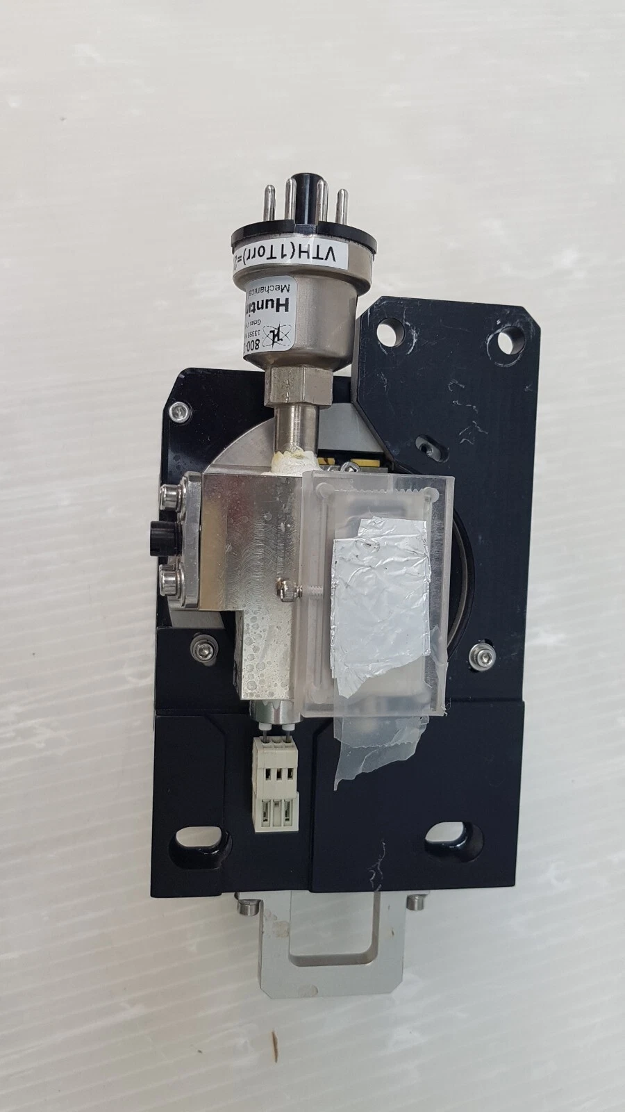 Mounting plate of the assembly with gauge tube and clear cover