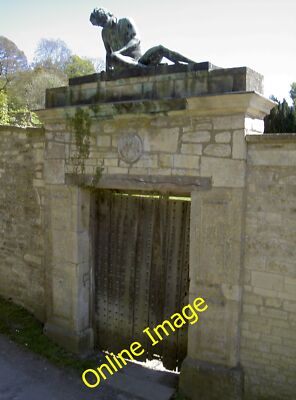 Photo 6x4 Waiting for visitors Avoncliff A bronze figure perched in antic c2013