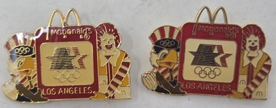 Lot Of 2 Vintage 1984 LA OLYMPIC PIN MCDONALDS SAM & RONALD HOLDING SIGN BANNED