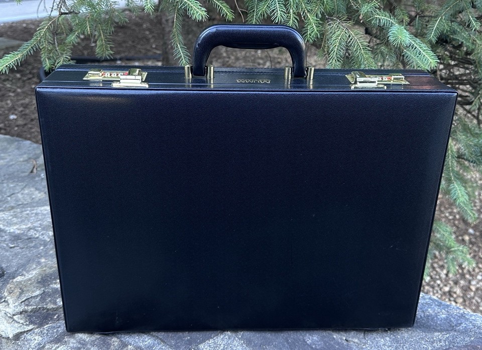 A brand-new old-stock G.H. Mumm Champagne branded attaché case — luxury brand promo artifact that's equal parts stylish carry and quirky collector's piece.