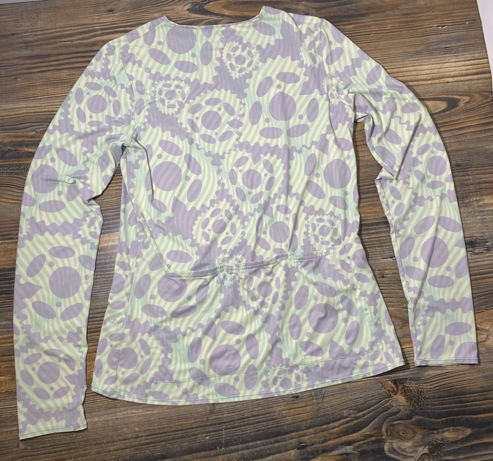 Top de ciclismo de manga larga con suela para bicicletas de rizo para mujer L cuello redondo UPF 50+ engranajes Foto 3 de 4