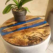 Handmade epoxy side table. 20 inches wide with handmade pin legs. Wood and resin