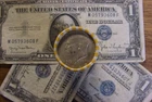 Kennedy half dollar roll with a 40% silver 1968 half on end in vV- good cond.