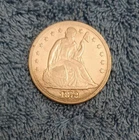 1872 Liberty Seated dollar, Extra Fine, toned, and highly reflective