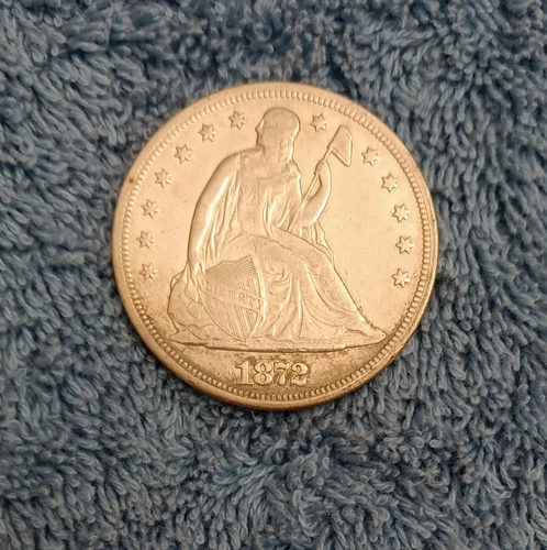1872 Liberty Seated dollar, Extra Fine, toned, and highly reflective