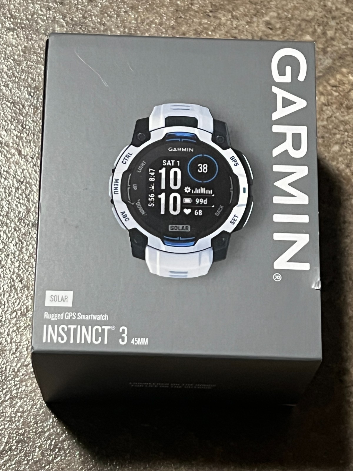 Reloj inteligente Garmin Instinct 3 Supernova GPS para exteriores 45 mm piedra blanca solar/azul