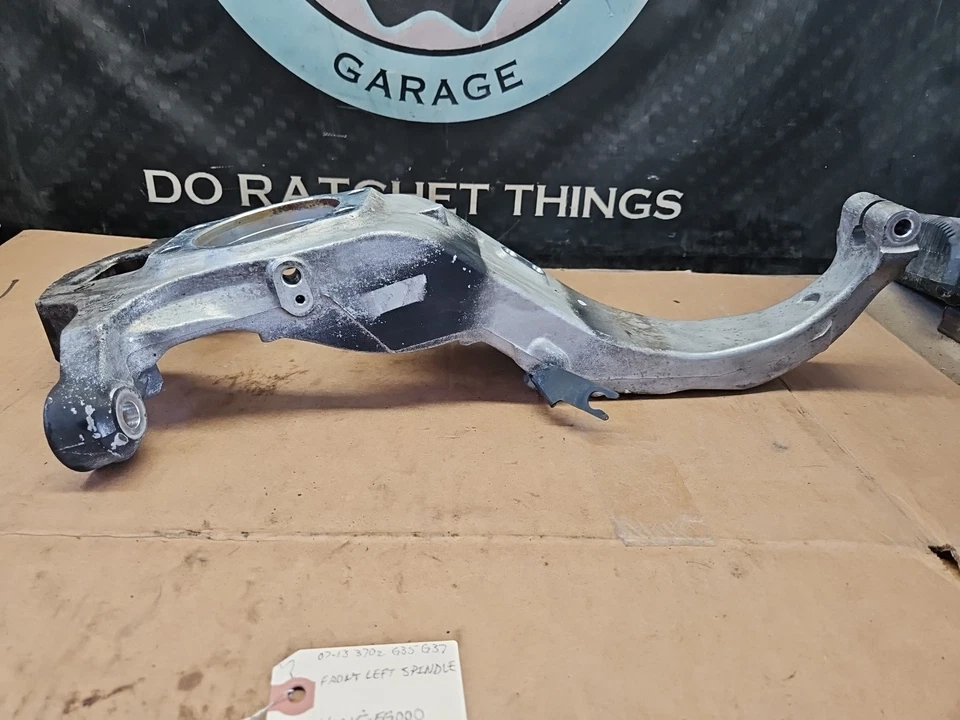 07-13 Nissan 370z Infiniti G35 G37 tracción trasera delantero izquierdo nudillo husillo 40015-EG000 Foto 3 de 4