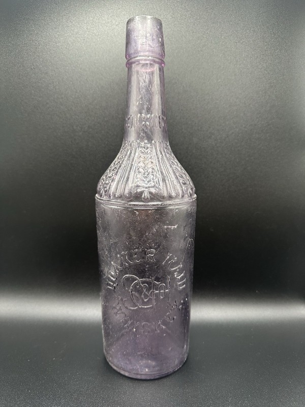VINTAGE LAVENDER QUAKER MAID WHISKEY  PATENTED 1538 GLOW GREEN GLASS BOTTLE