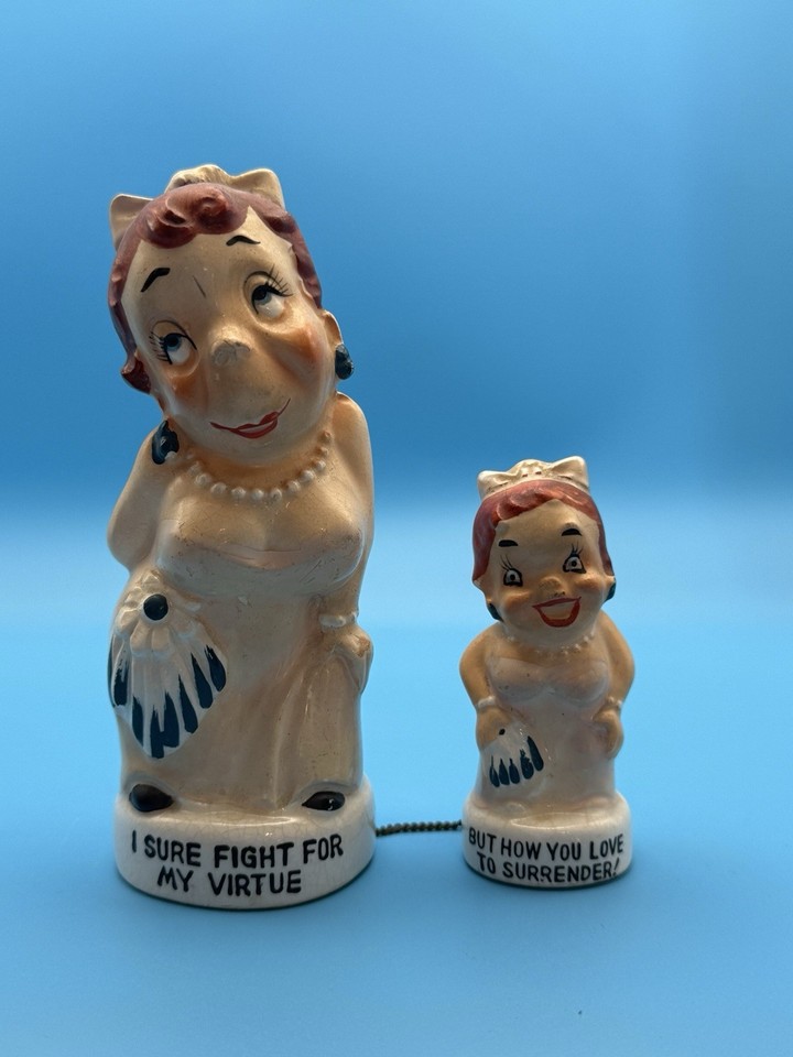 1959 Japanese novelty 'chained' risqué figurines with mid-century humor — a genuinely rare, eyebrow-raising conversation piece you won't find at any gift shop.