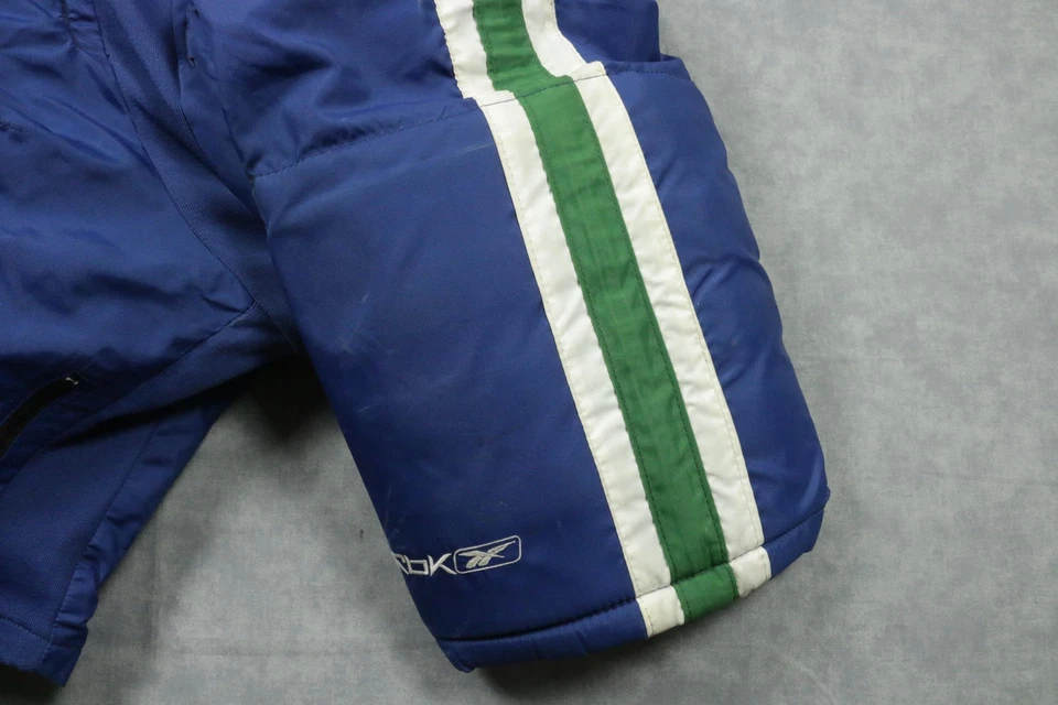 Pantalones de hockey Vancouver Canucks usados en juegos grandes Reebok MHP7000 SE NHL Foto 2 de 4