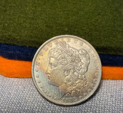 (#100649).  Morgan Dollar: 1882 O....  au.  rainbow toning!    (see video!)