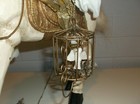 Old World Saint Nick Riding on a Wooden Horse Holding a Bird in a Cage  — photo 7