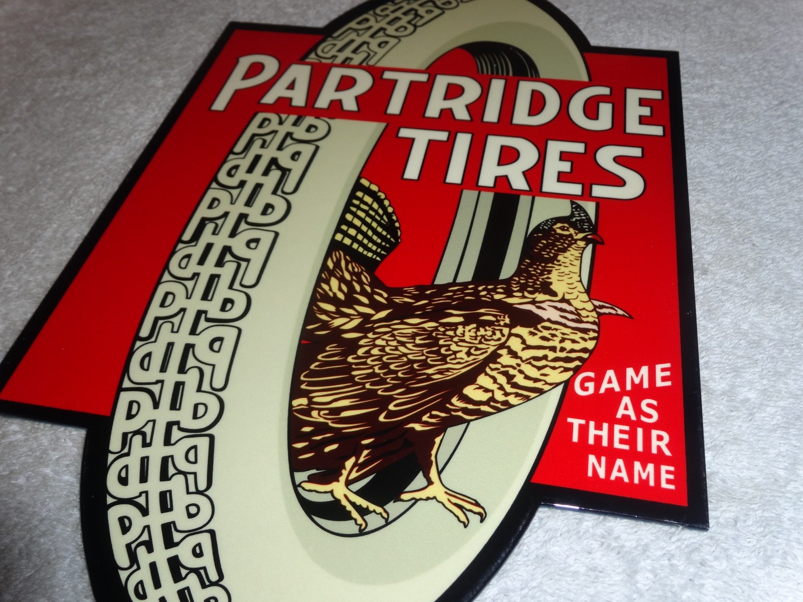 VINTAGE "PARTRIDGE TIRES" W/ HEN / ROOSTER 12" METAL TIRE GAME GASOLINE OIL SIGN