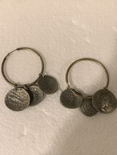 vintage-style earring featuring repops of ancient Roman coins on a hoop.  Set