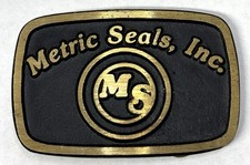 Vintage 1980s Metric Seals, Inc. Advertising Brass Belt Buckle