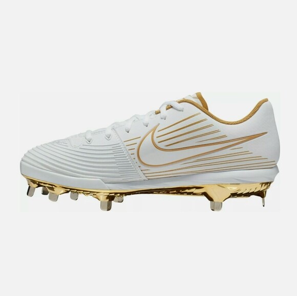 gold and white softball cleats