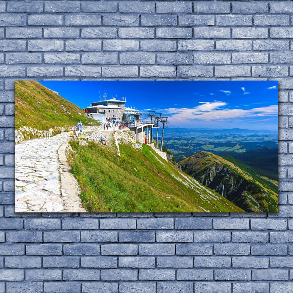Tableau acrylique paysage montagnes 140x70 pour illuminer un salon sombre et vide
