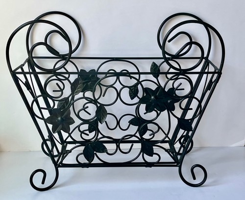 Black wrought iron/metal decor item, plant holder, magazine rack, folds flat