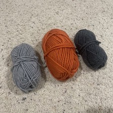 Lot Of 3 Spools Of Yarn - Charcoal Gray, Light Gray, And Orange