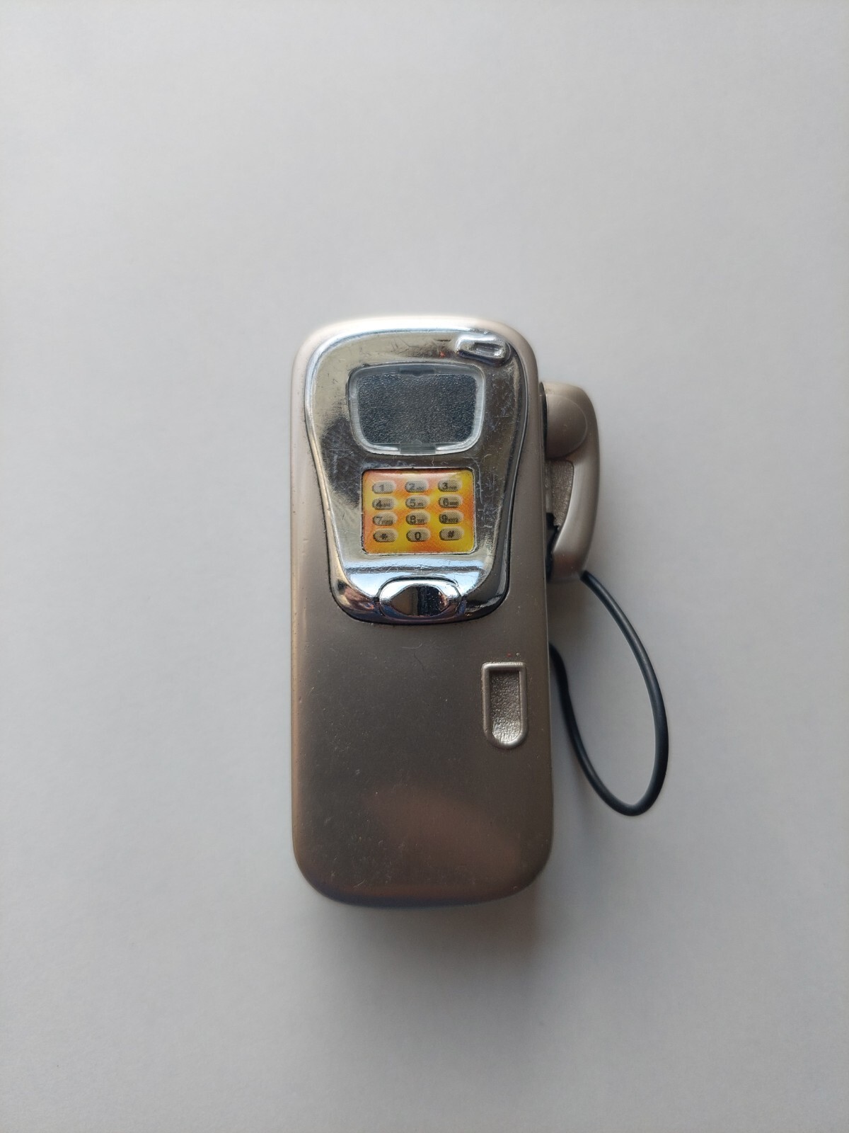 Wall Phone Novelty Lighter, Grey With Button Pad, Phone Side Mount Clicker