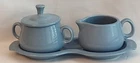 Fiesta Periwinkle Blue Creamer And Lidded Sugar Bowl Resting On A Serving Tray