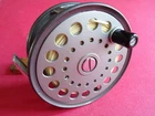 A SUPER VINTAGE LEFT HAND WIND 4 1/8" WIDE DRUM GRENABY PATTERN SALMON FLY REEL