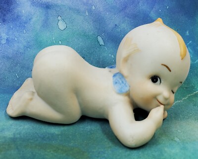 KE1 Porcelain Kewpie Winking Laying On Belly Finger At Mouth Figurine 1.75'' X 3''