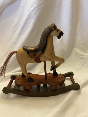 antique hobby horse on wheels