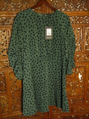 green dress with black polka dots