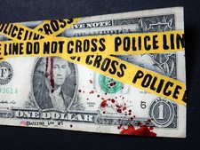 Police Crime Scene Tape, Do Not Cross Tape painted on real one dollar banknote. 