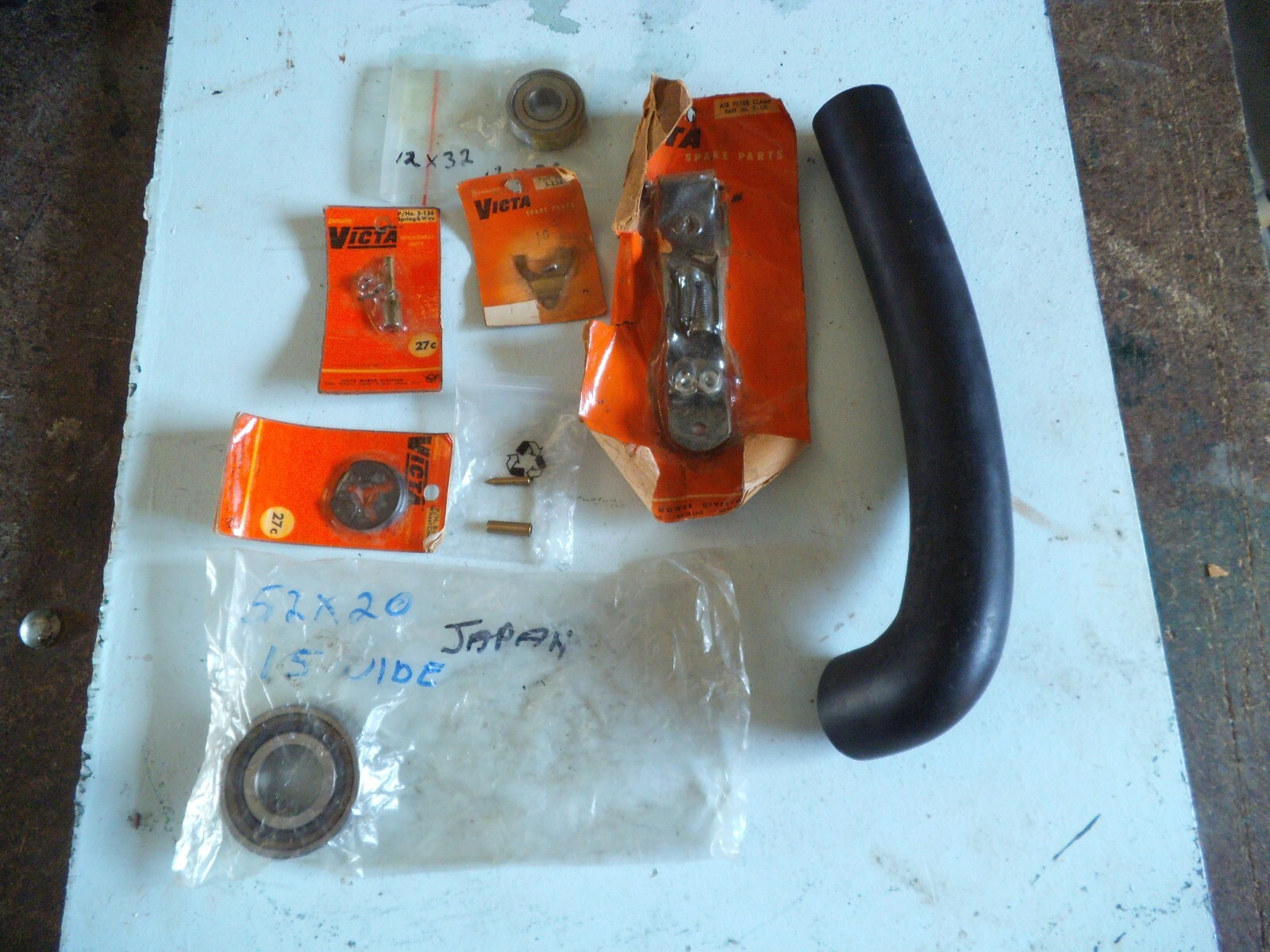 Assortment of early victa lawn mower parts all new suit various models