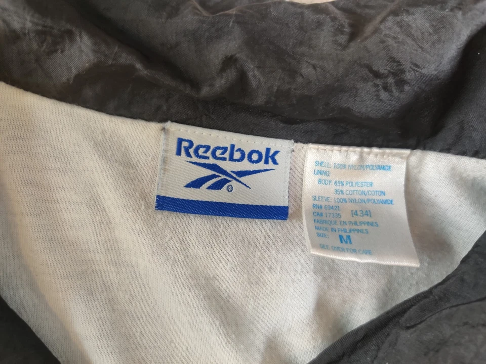 Chaqueta cortavientos vintage Reebok para mujer mediana cremallera completa púrpura negro bloques de color Foto 2 de 4