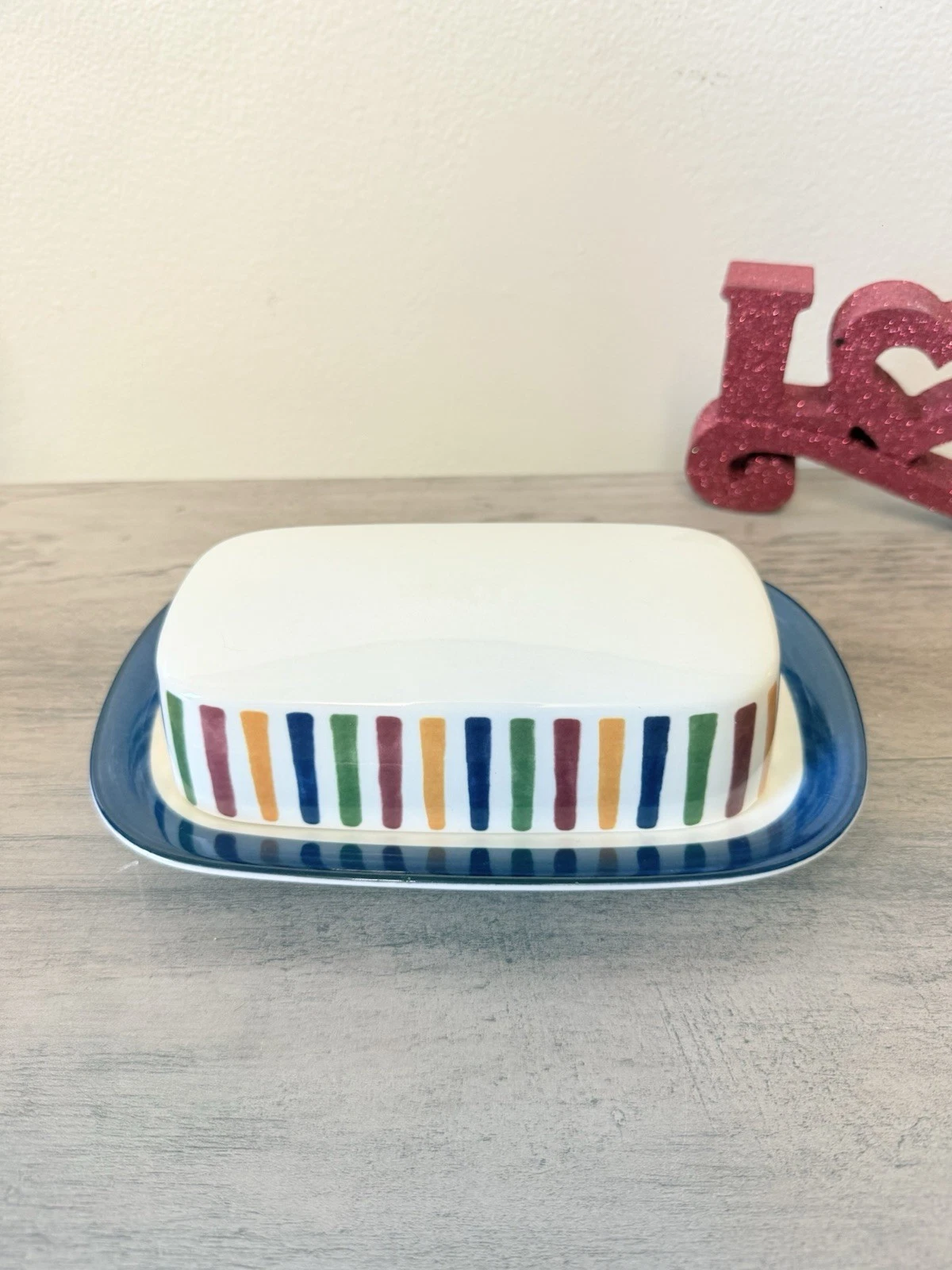 Mikasa Harmony Covered Butter Dish with colorful stripe pattern.