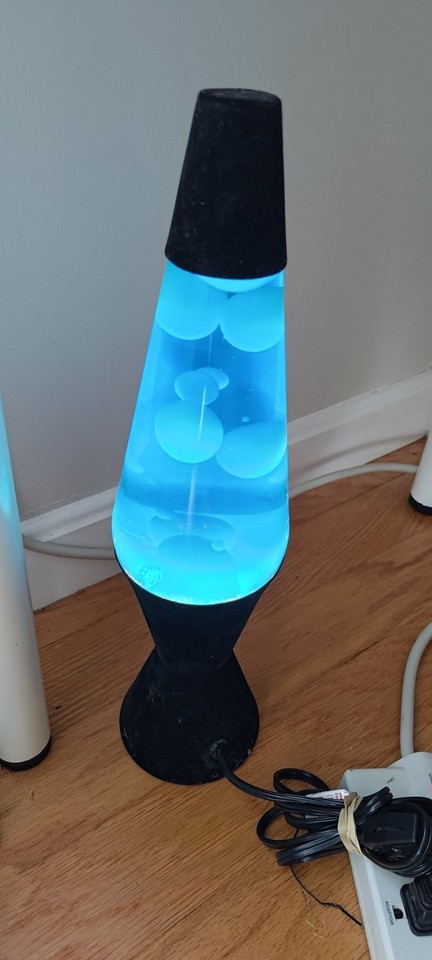 A working 1990s 16" lava lamp with blue liquid and white lava — the original tall vintage form factor that kicked off the whole aesthetic.
