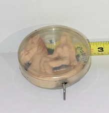 early crank wind Lady Godiva plastic case rubber figure that twist functions